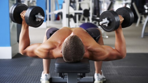 Man Pressing Dumbbells